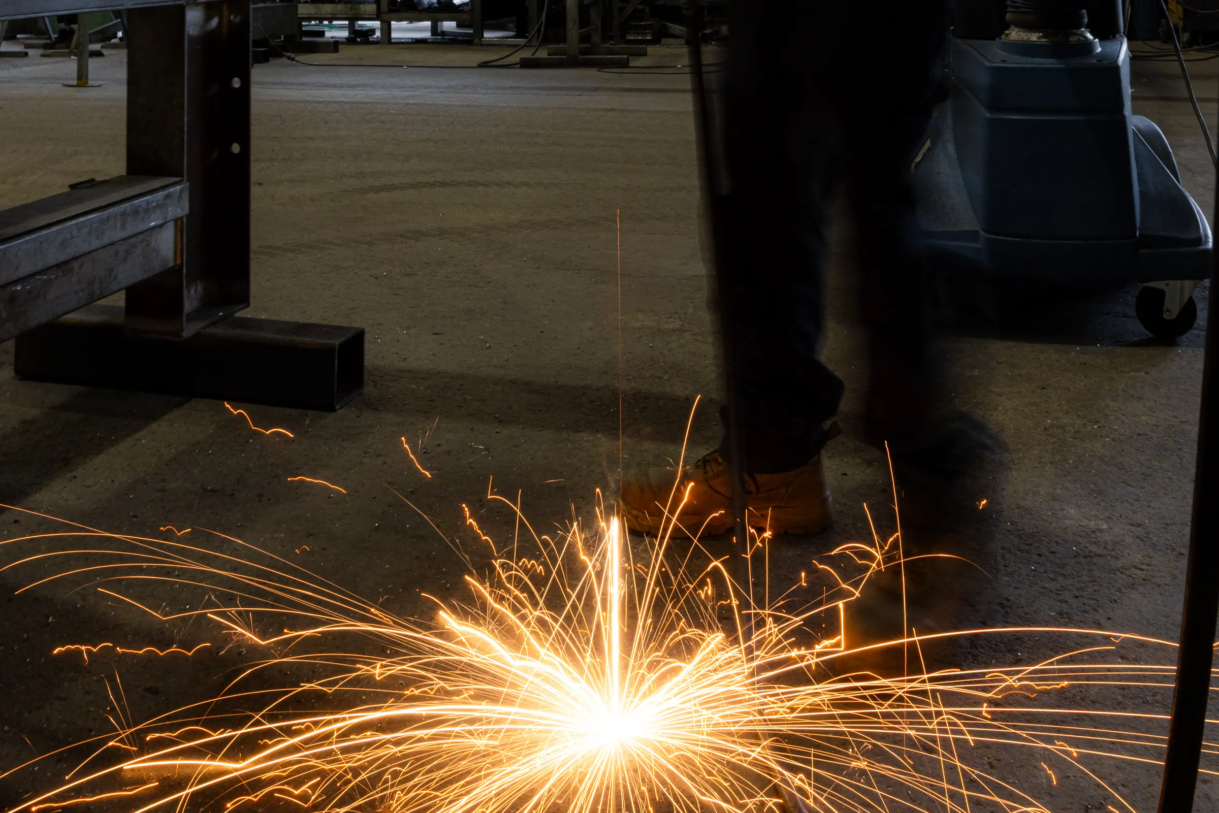 Sparks across the workshop floor