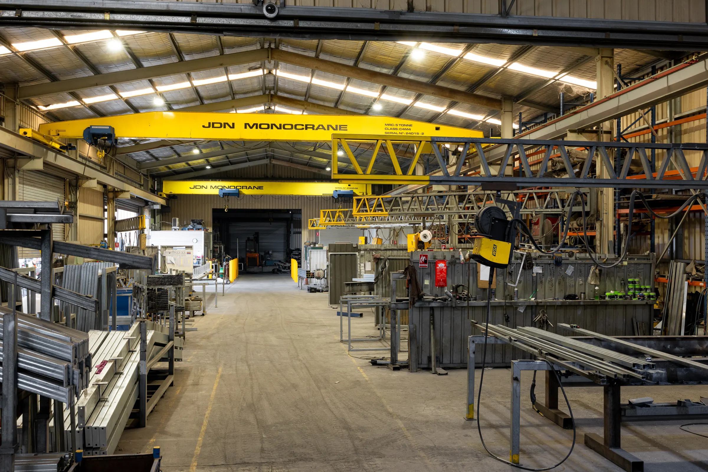 Inside a large clear-span steel building